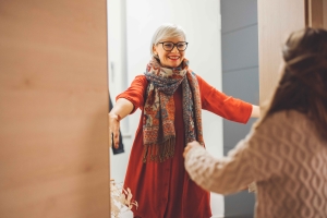compressed-a-woman-in-a-red-dress-helps-a-young-boy-with-his-2026-01-07-06-46-09-utc